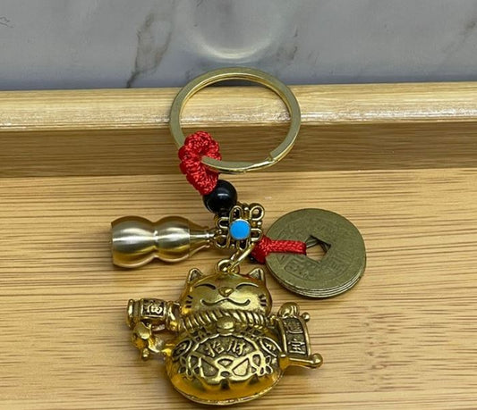 Metal Sans ve Bereket Figurleri Anahtarlik - TrendTrove